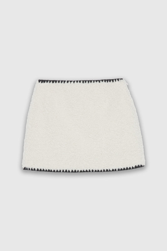 MINI SKIRT IN FAKE SHEEPSKIN LEATHER WITH EMBROIDERED HEM 