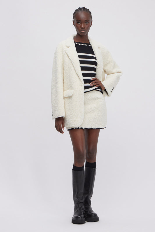 MINI SKIRT IN FAKE SHEEPSKIN LEATHER WITH EMBROIDERED HEM 