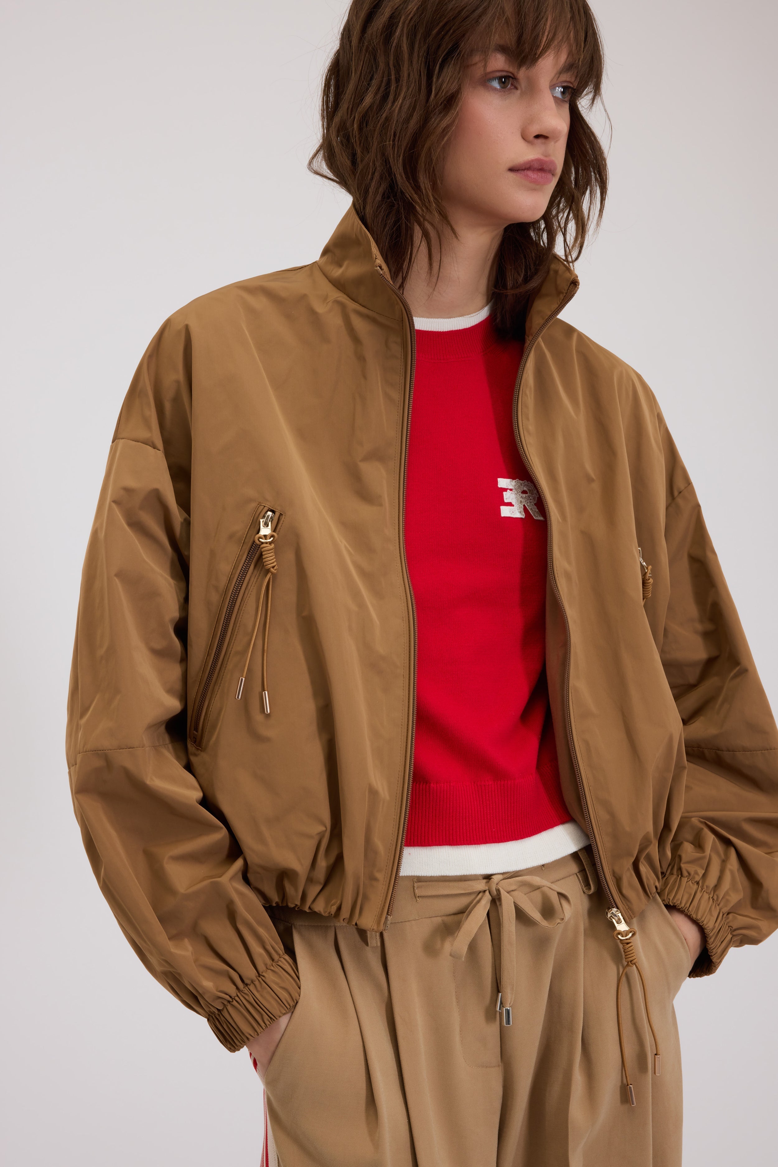 K-WAY EN TAFFETAS AVEC BORD RETROUSSÉ