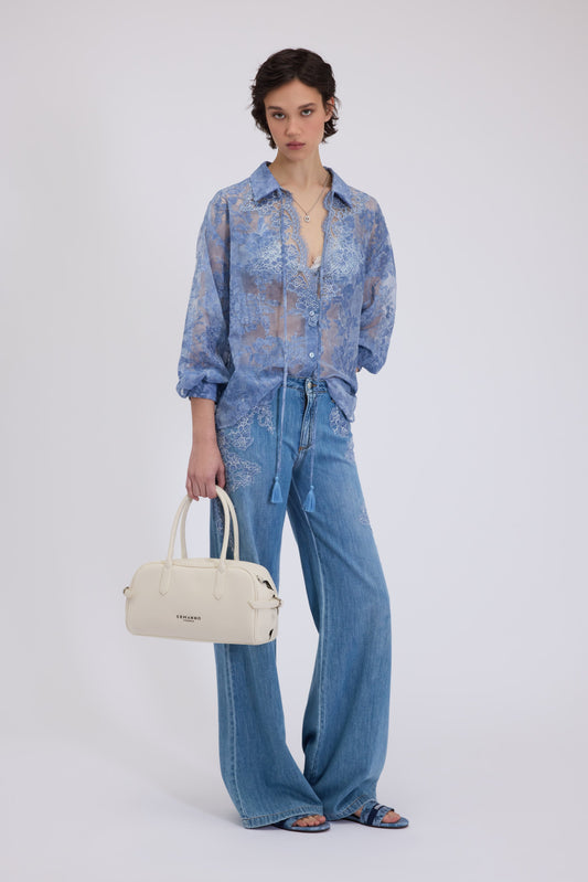 JEANS FLARE CON PIZZO RICAMATO SUI FIANCHI