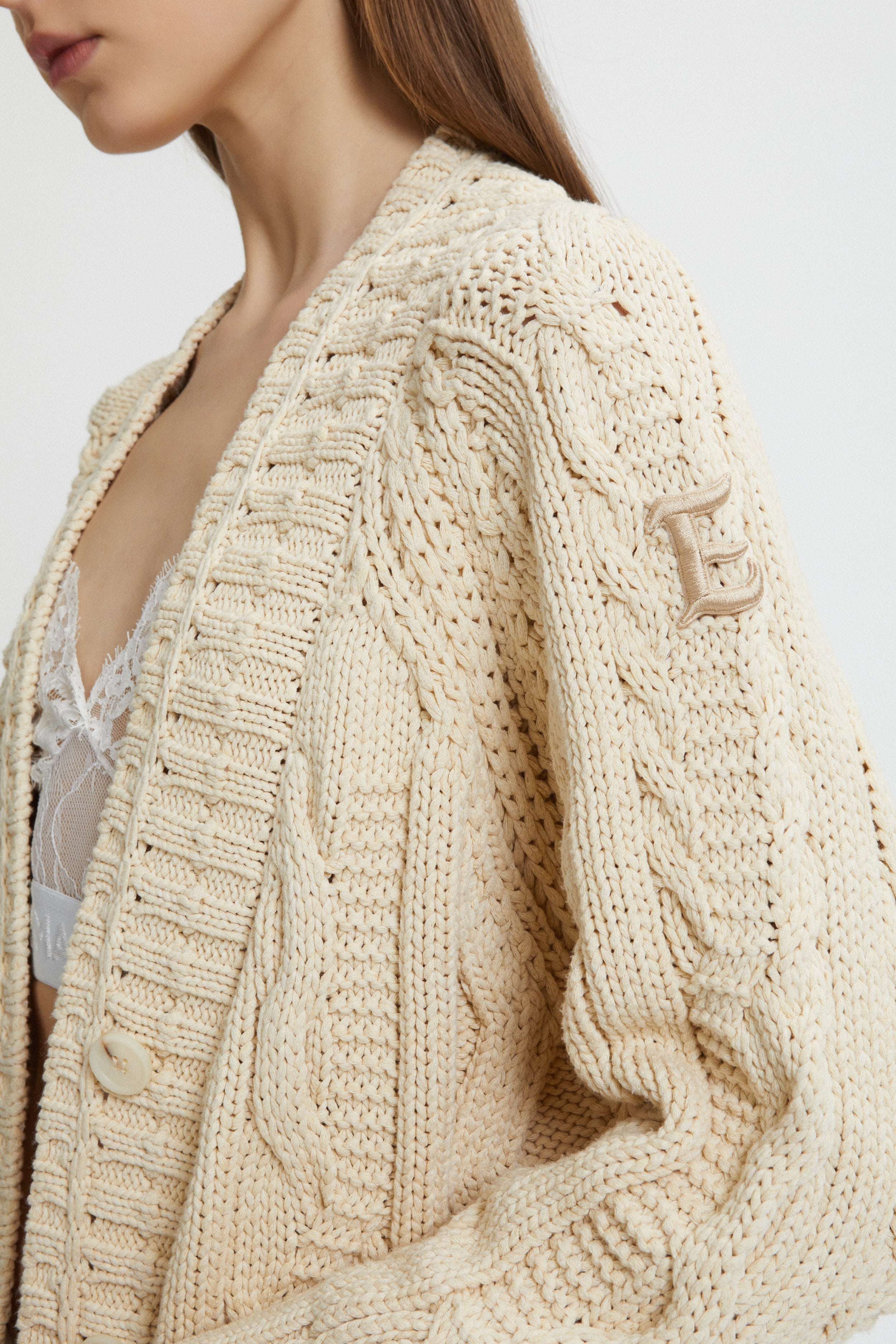 CARDIGAN A TRECCE CON TASCHE